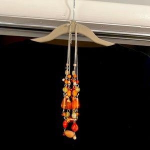 Women’s silver three strand necklace orange green and beige
